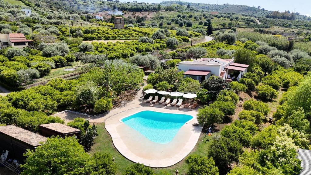 an aerial view of a villa with a swimming pool at Terre e Torri Country Resort in Lascari