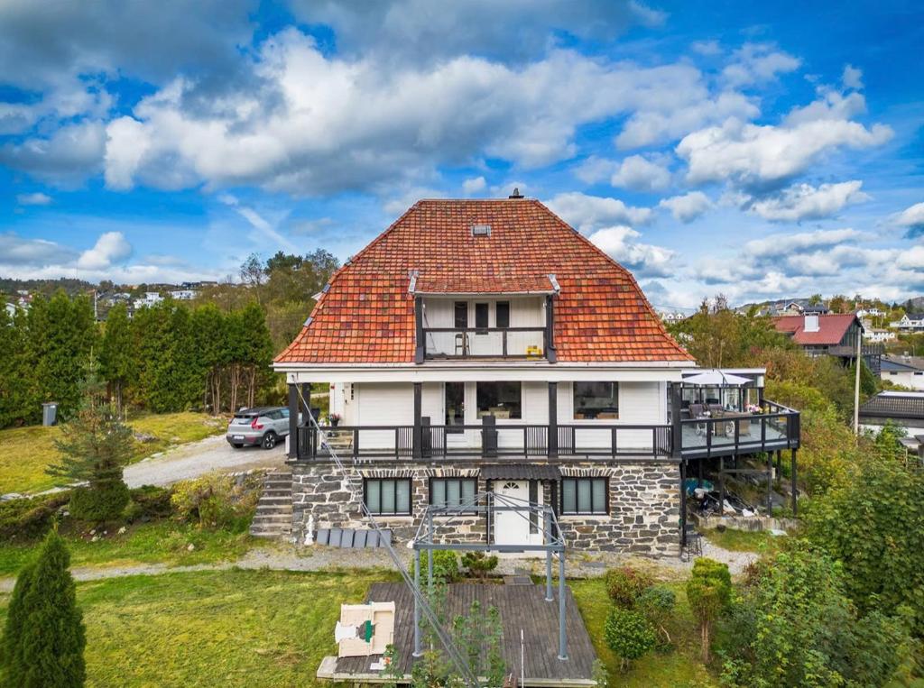 an old house with an orange roof at Arya villa in Bergen
