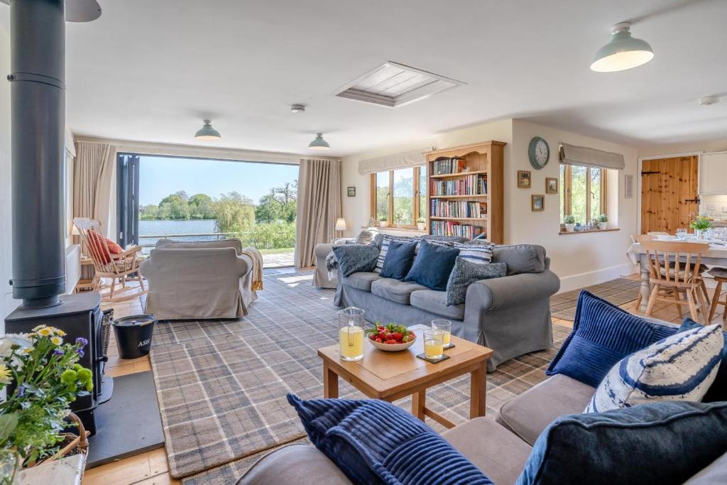 a living room with couches and a fireplace at 3 Bed in Bassaleg oc-bow138 in Bassaleg