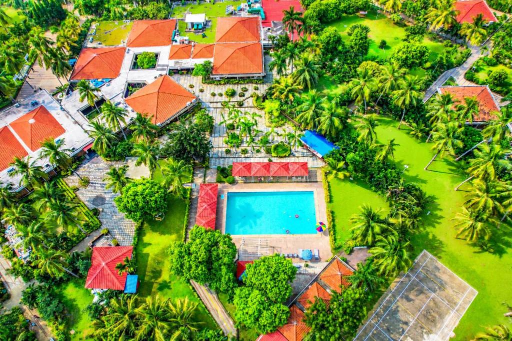 an aerial view of a house with a swimming pool at Toshali Sands Nature Escape Puri in Puri