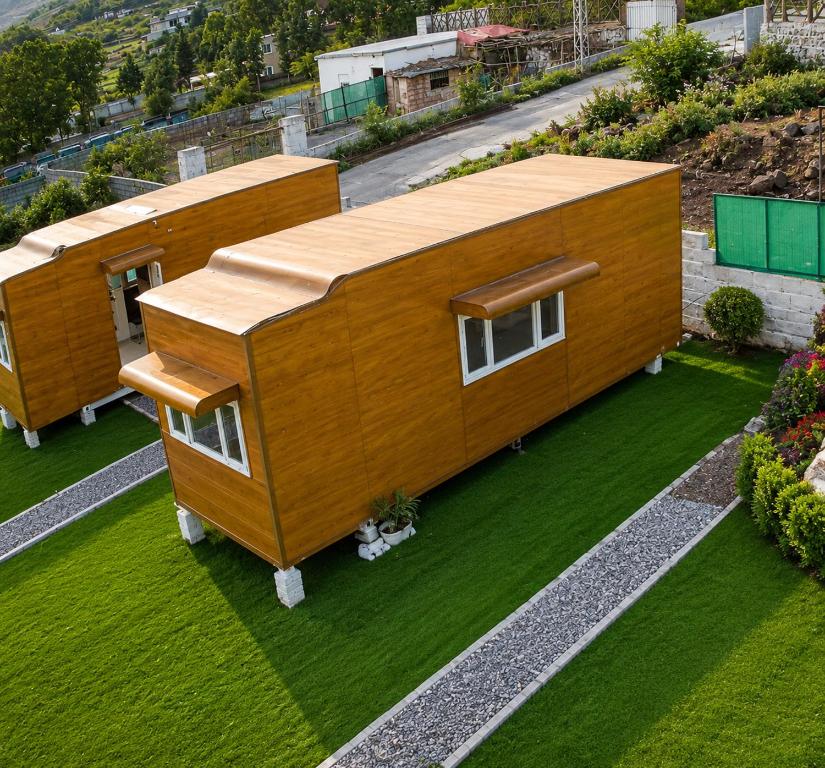 an overhead view of a wooden house on a lawn at The Onyx by 7 Valleys in Islamabad