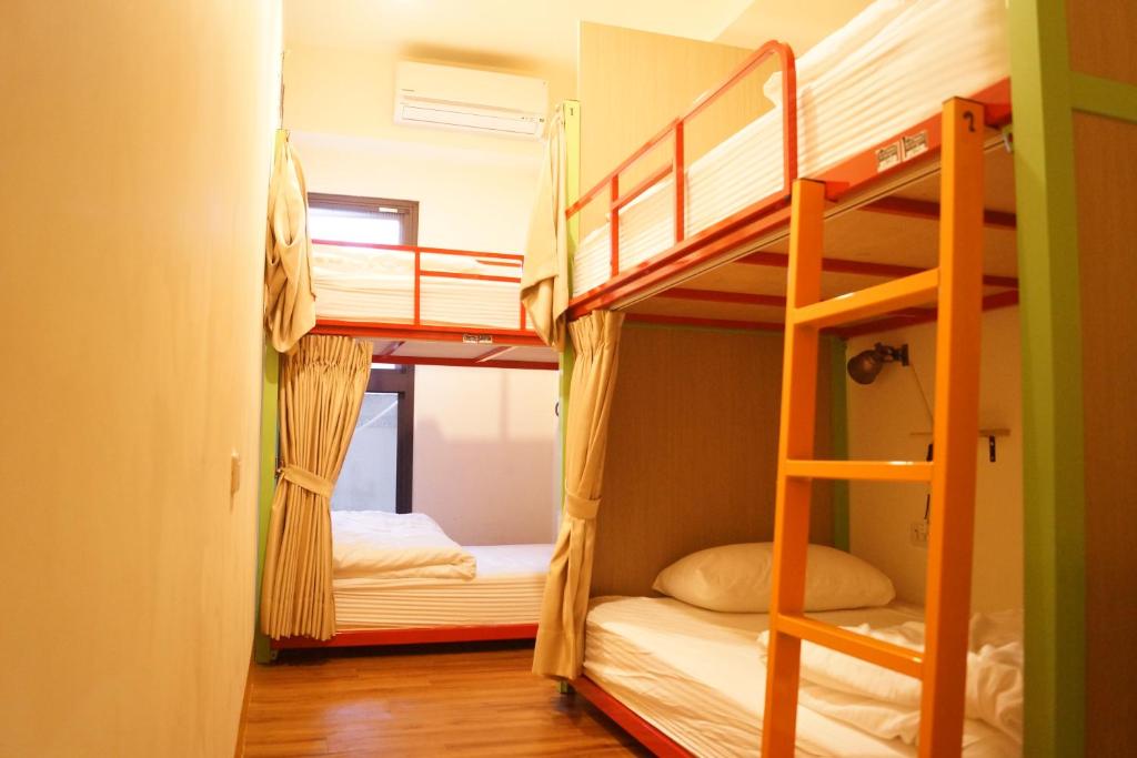 Postel nebo postele na pokoji v ubytování Trip GG Hostel