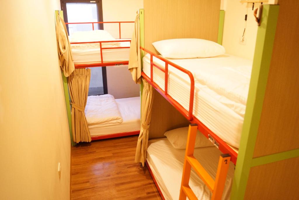 Postel nebo postele na pokoji v ubytování Trip GG Hostel