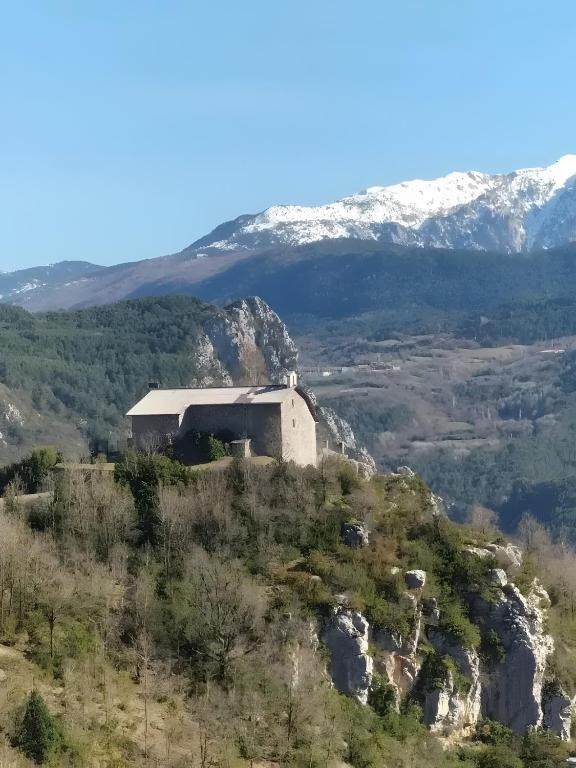 a building on the side of a mountain with snow at Casa Rural David in Chía