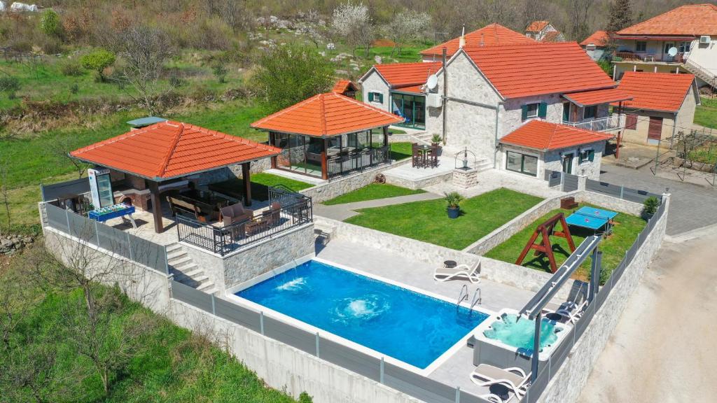 an aerial view of a house with a swimming pool at Villa Ivandvor in Split by Villas Guide in Radošić