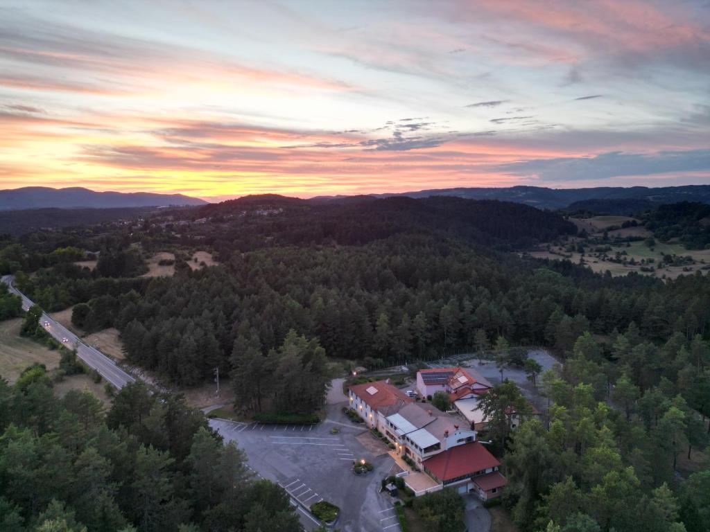 an aerial view of a building in the middle of a forest at Hotel Finida in Obrov