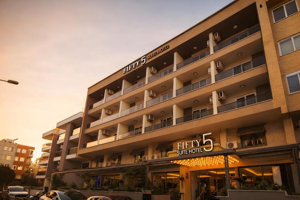 a large building with a hotel sign on it at FIFTY5 Suite Hotel in Marmaris