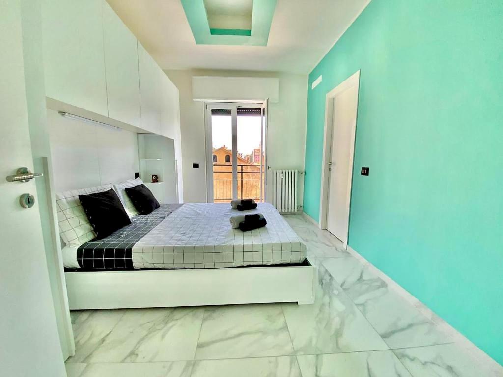 a bedroom with a bed with a teddy bear on it at Gran Premio Monza - Autodromo con Wi-Fi e aria condizionata in Monza