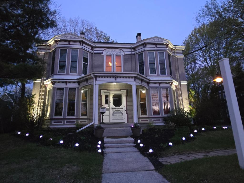 a large house with lights in front of it at Blackberry Inn in Camden