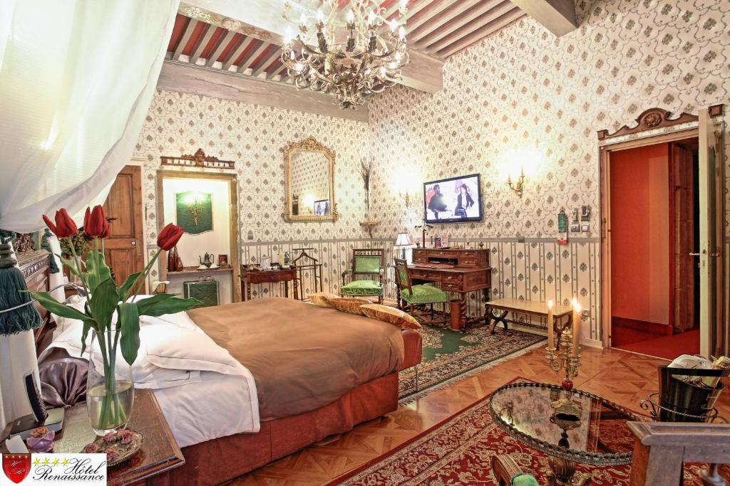 Letto o letti in una camera di Hôtel Renaissance