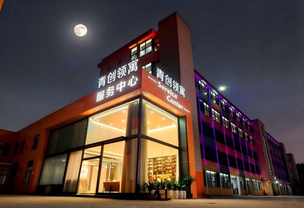 a large building with the moon in the sky at Youth Innovation Apartment in Guangzhou