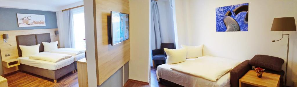 Postel nebo postele na pokoji v ubytování BlnCty Hotel