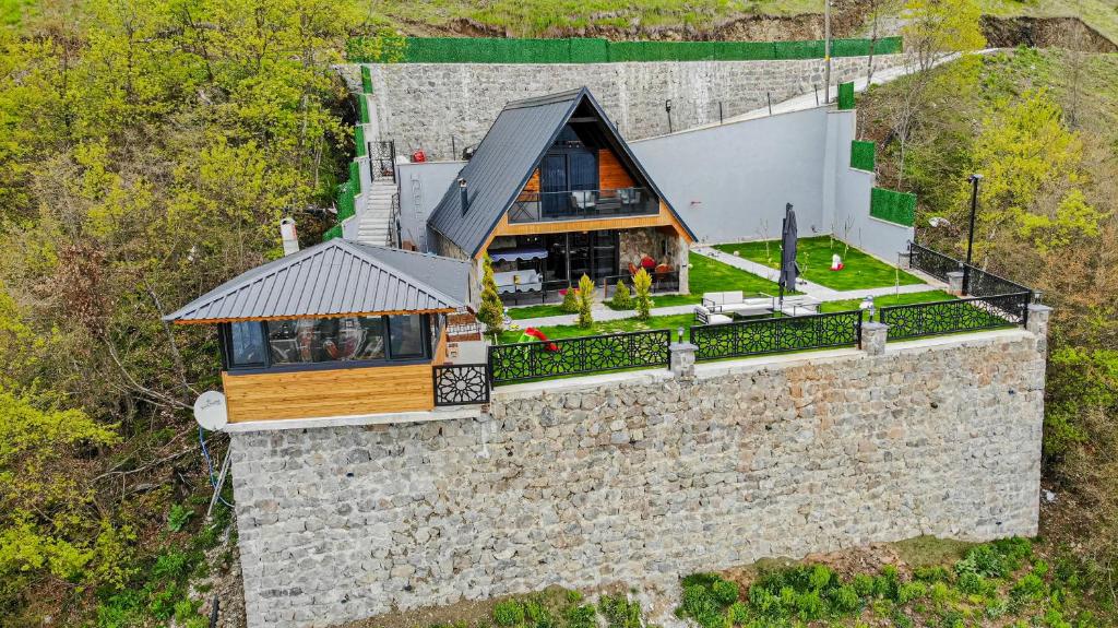 an aerial view of a house on a stone wall at Lefkali HOME in Çınarlık