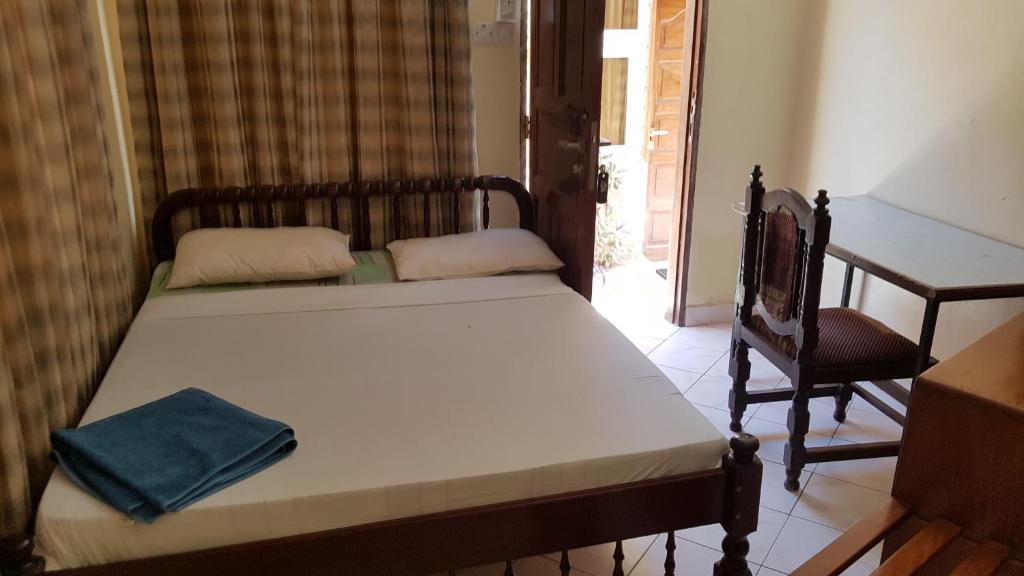 Postel nebo postele na pokoji v ubytování Regency Inn Tudor