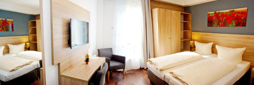 Postel nebo postele na pokoji v ubytování BlnCty Hotel