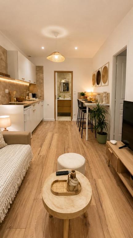 a living room with a couch and a table at Casa Luna in Saint-Chamond