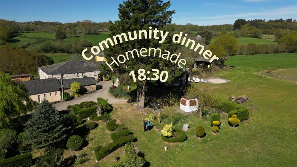 an overhead view of a community clinic sign in a field at A casa de Carmen in Sarria
