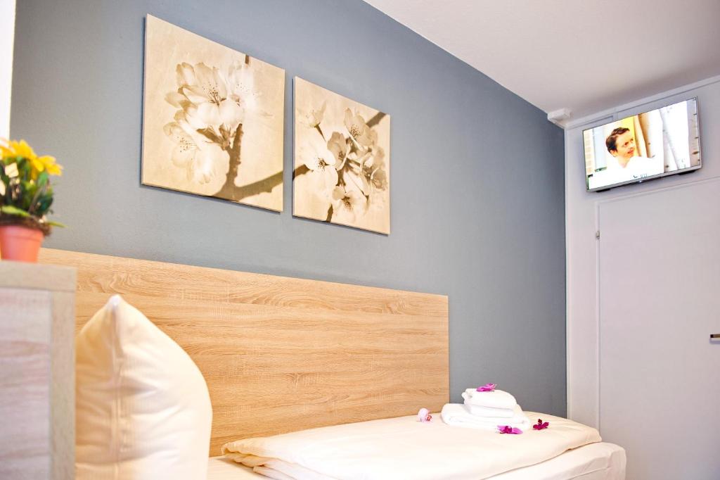 Postel nebo postele na pokoji v ubytování BlnCty Hotel