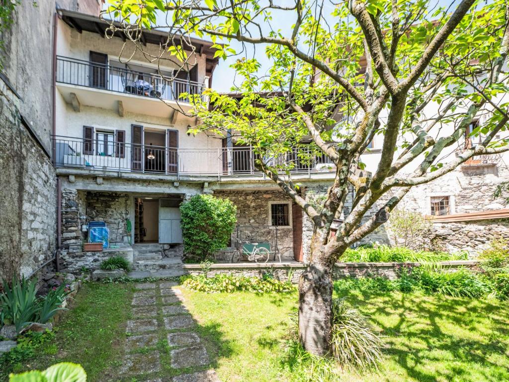 an old building with a tree in front of it at Holiday Home Iside by Interhome in Mergozzo