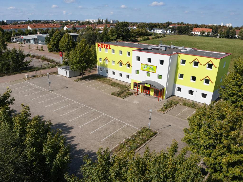 an aerial view of a building with a parking lot at Hotel City Inn in Magdeburg