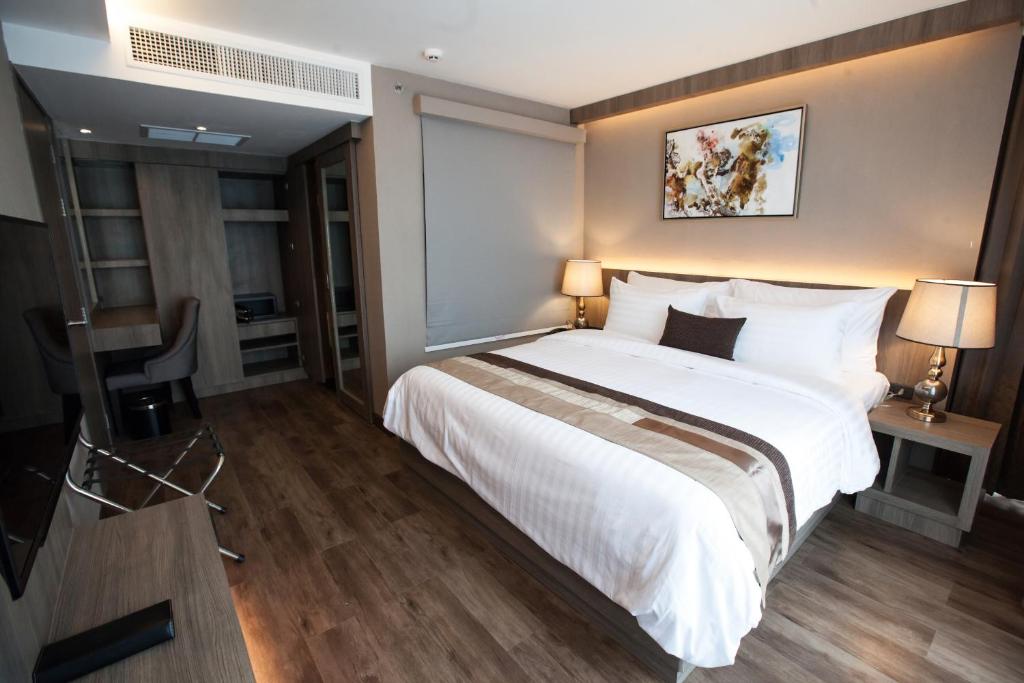 Postel nebo postele na pokoji v ubytování Arte Hotel - SHA Extra Plus