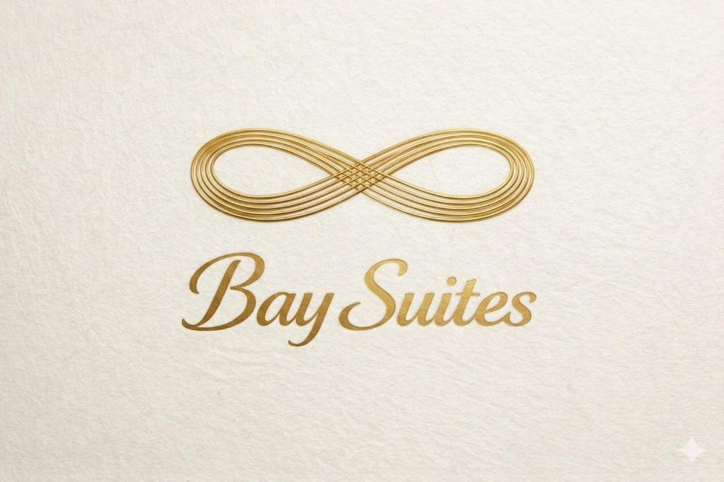 a gold ribbon with the words bay suites on it at Infinity Bay Suites in Puerto Galera
