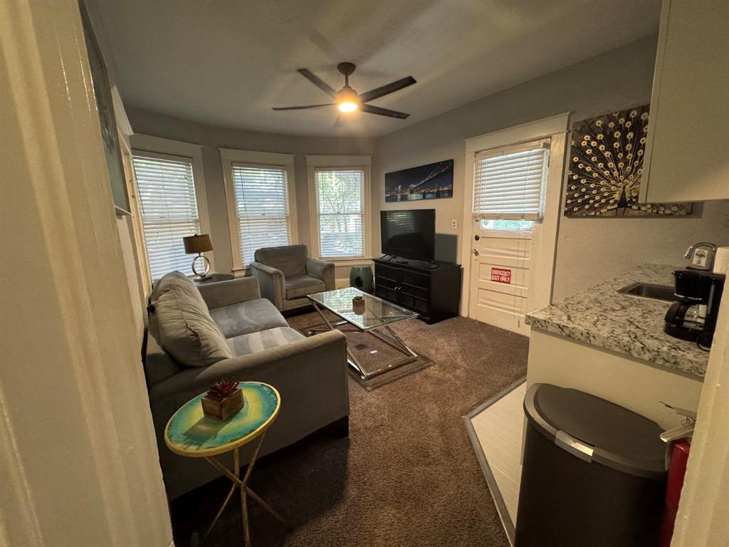 a living room with a couch and a table at Downtown Lake Eola Historic House 1 OR 2 BED in Orlando
