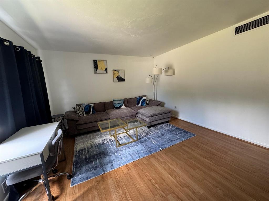 a living room with a couch and a table at Retro lake Eola 1 Bedroom Condo Thornton park in Orlando
