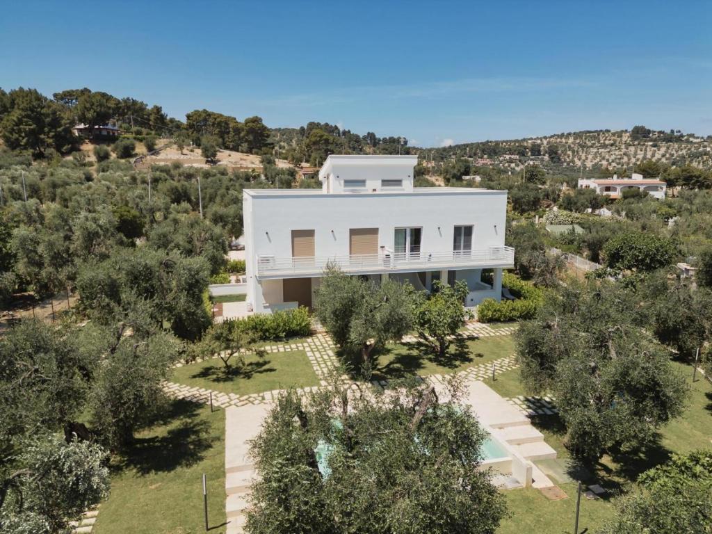 an aerial view of a white house with trees at Pilone del Monaco Apartment 9 in Vieste