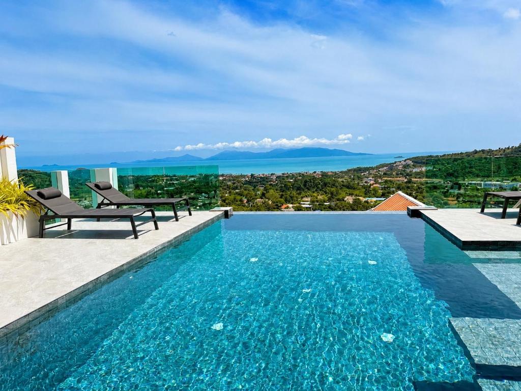 a swimming pool with a view of the ocean at Villa Best View Samui managed by Villa For You in Koh Samui