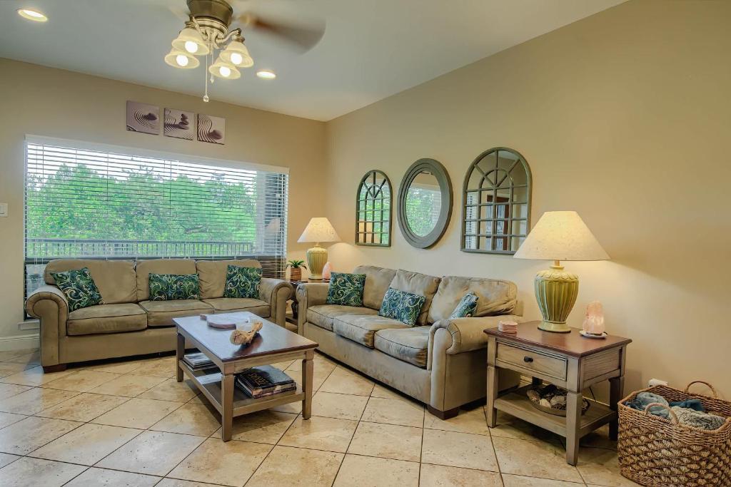 a living room with a couch and a table at CW C207 River Zen in New Braunfels