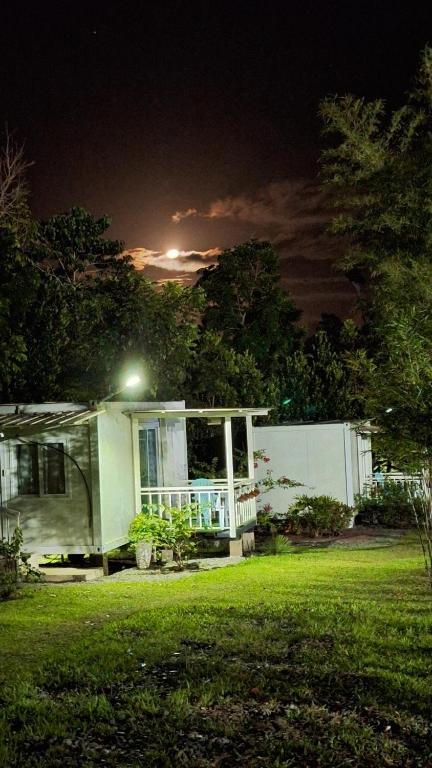 a small house in a yard at night at AsunEus Farm in Carmen
