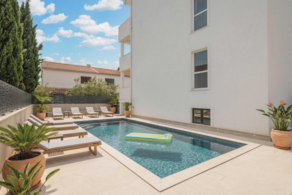an image of a swimming pool in a house at Villa JAM in Kaštela