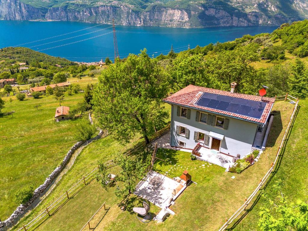 an aerial view of a house with a solar roof at Chalet Ca' la Fratela in Malcesine