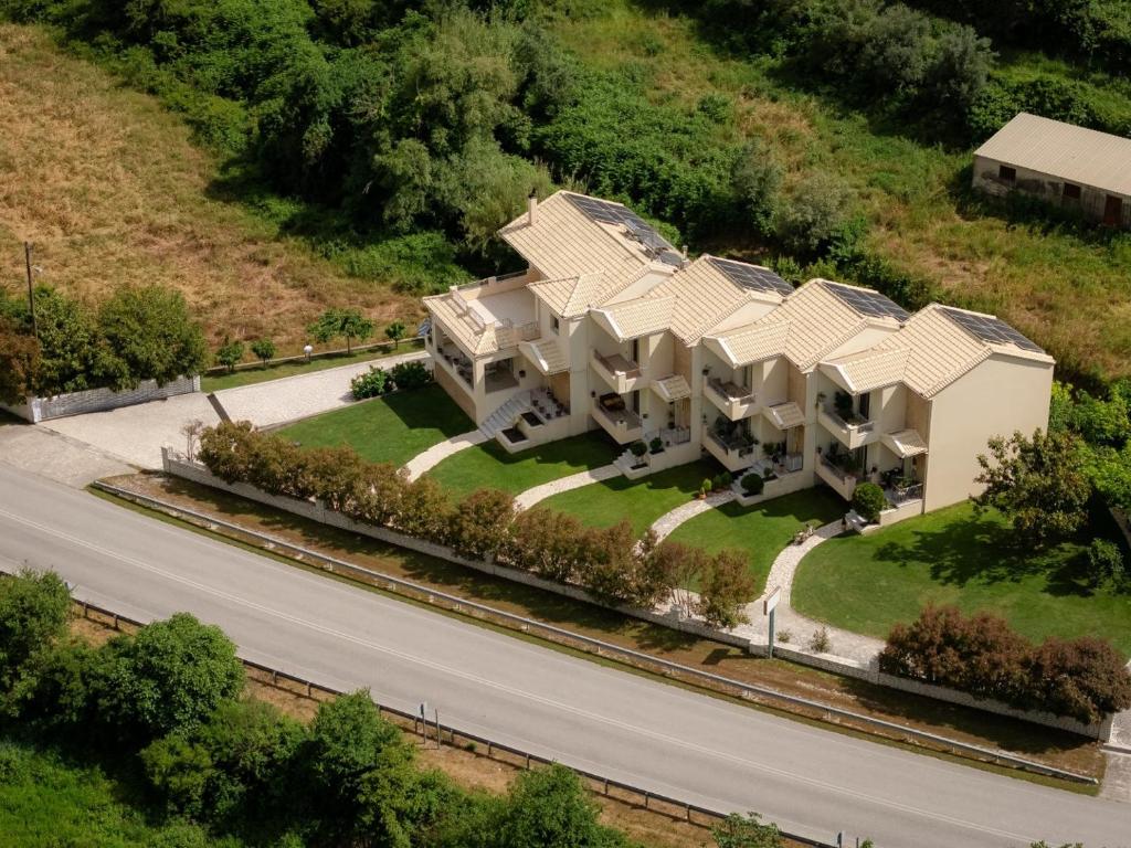 an aerial view of a building on a road at Ithaki Apartments in Paramythia