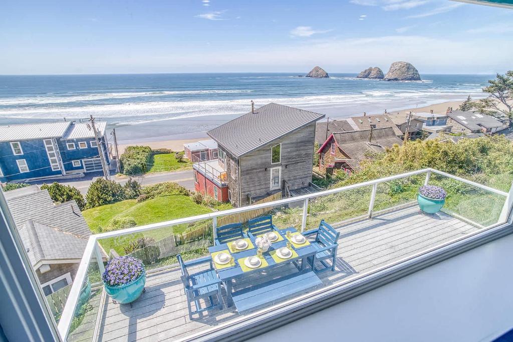 a balcony with a view of the beach and the ocean at Serendipity -A Happy Surprise Unit A in Oceanside