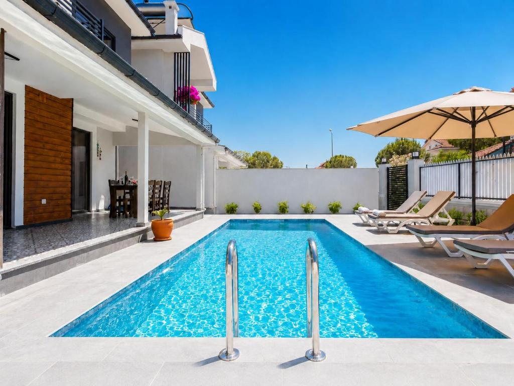 a swimming pool in the backyard of a house at Villa Exclusive Paradise 2 in Dalyan