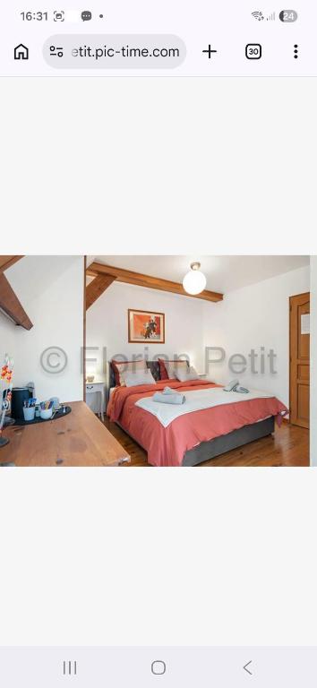 a bedroom with two beds in a room at L'instant présent in Hautot-lʼAuvray