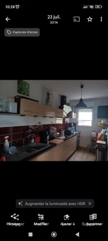 a screenshot of a kitchen with a picture of a kitchen at Eugenie86 chbre2 in Poitiers