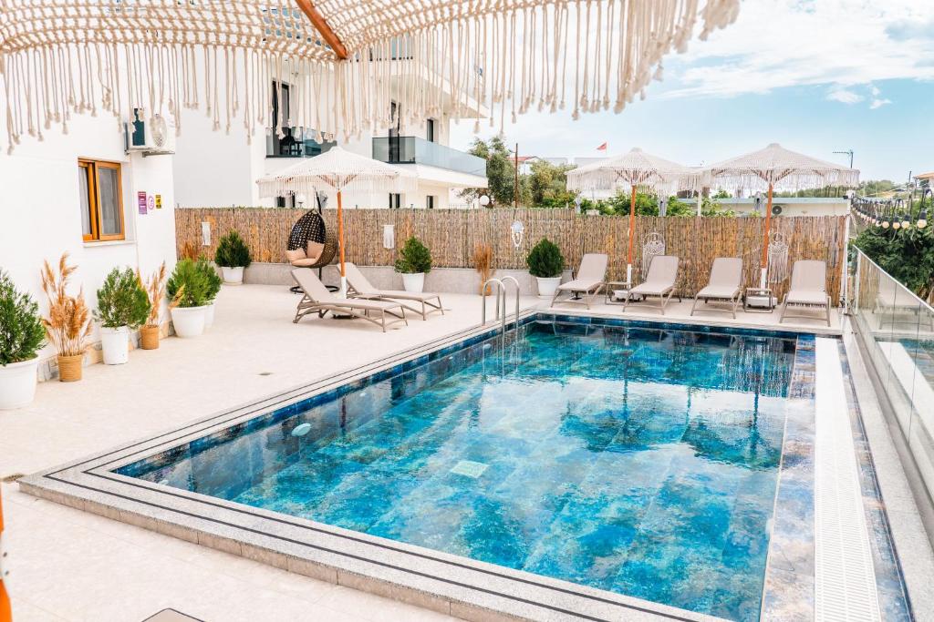 a swimming pool on the roof of a house at Vila Finnley in Ksamil
