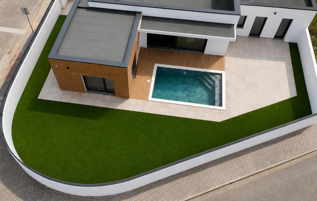 a model of a house with a swimming pool at IROC Private Garden in Quinta do Anjo