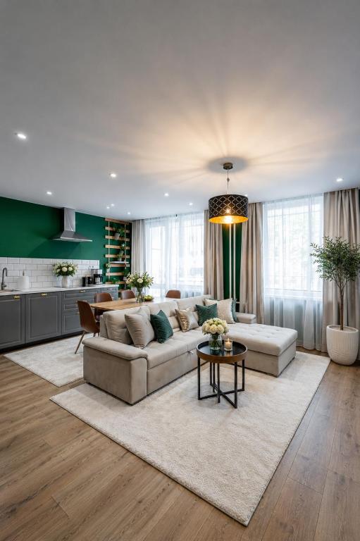 a living room with a couch and a table at Flora Apartment Kosice Center in Košice