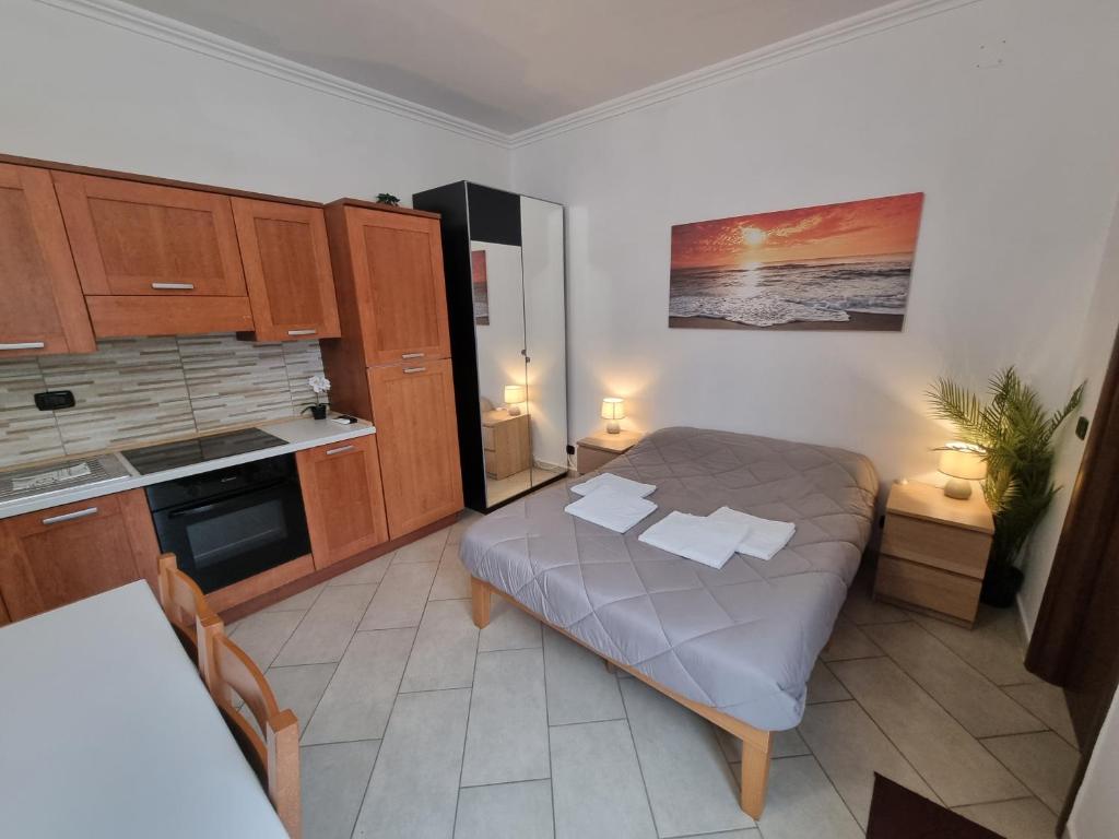 a small kitchen with a bed in a room at Red Rose Tiburtina in Rome