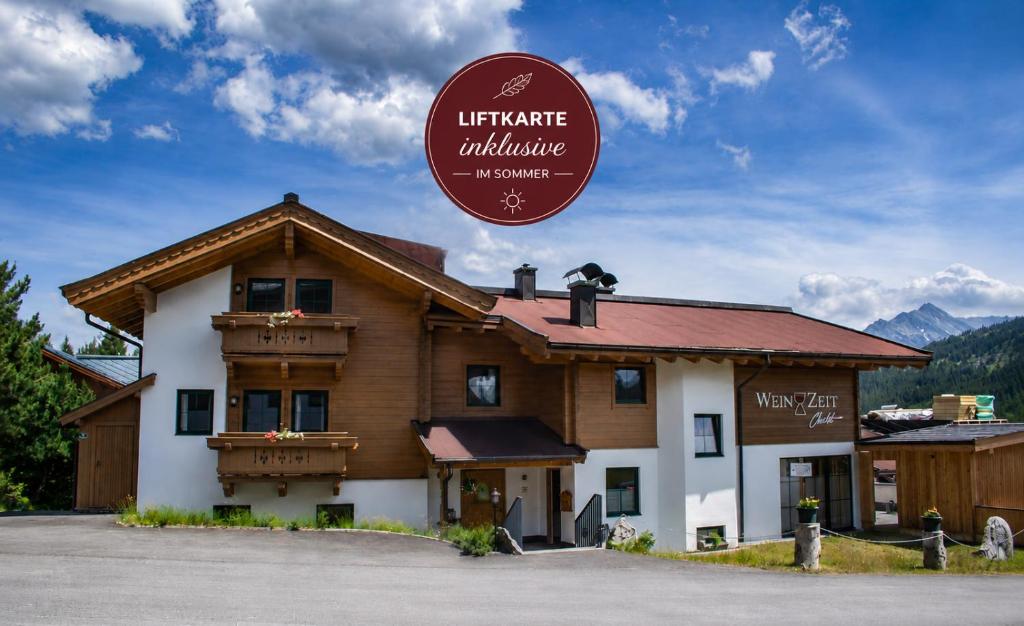 a building with a sign that reads interpreter albuquerque at Reichenspitzblick Appartement in Königsleiten