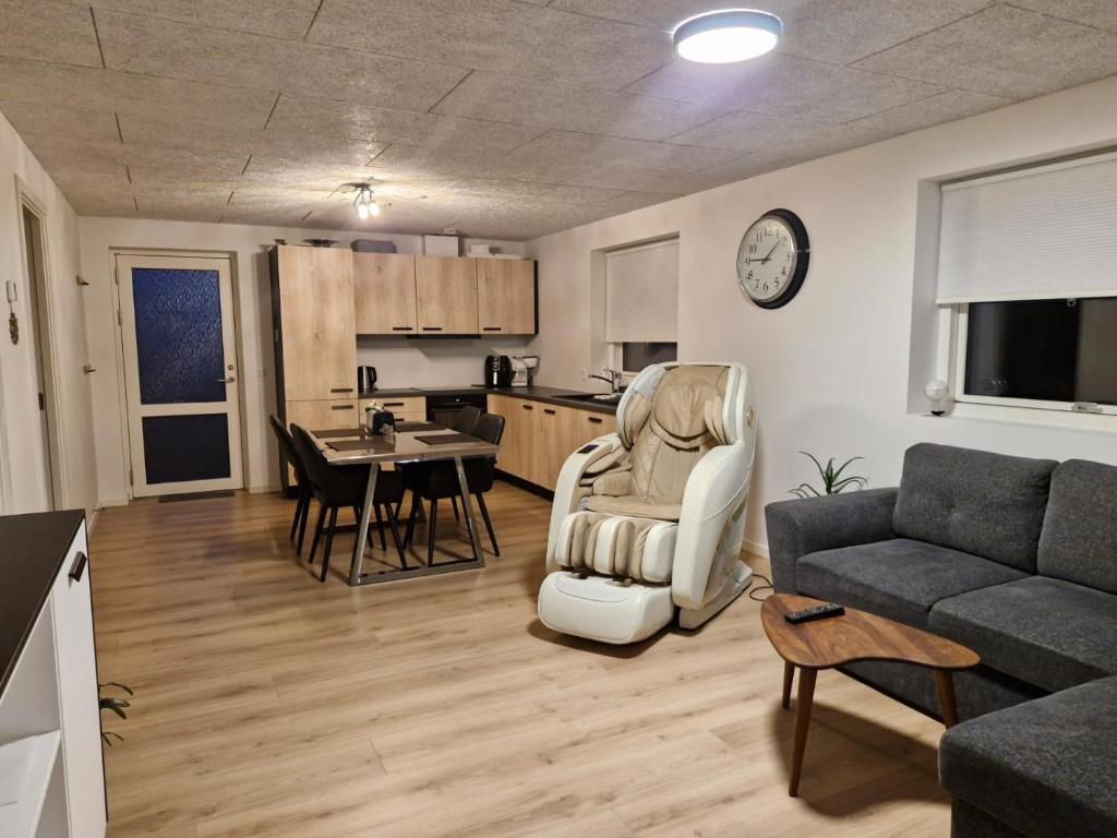 a living room with a couch and a table at New apartment, only 4 km from the highway in Horsens