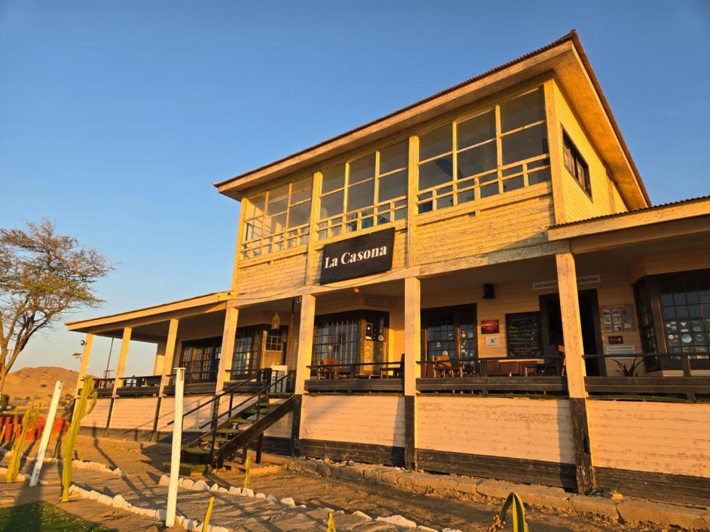 a large building with a sign that reads la corona at La Casona de Lobitos - Cowork in Lobitos