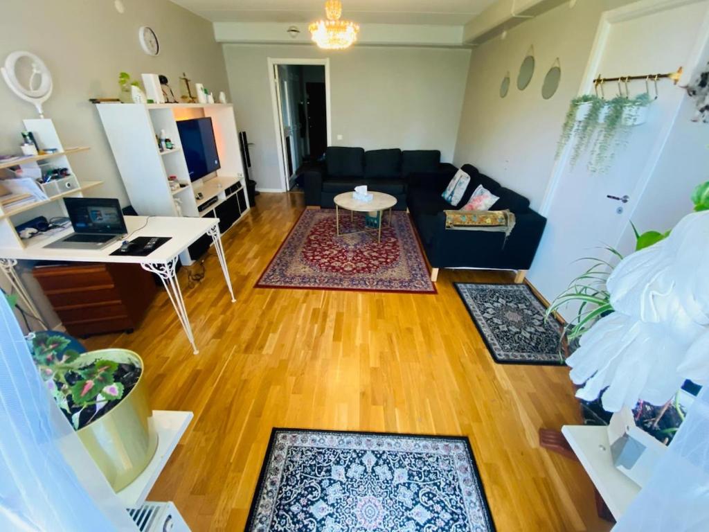 a living room with a couch and a table at Adam1 in Uppsala