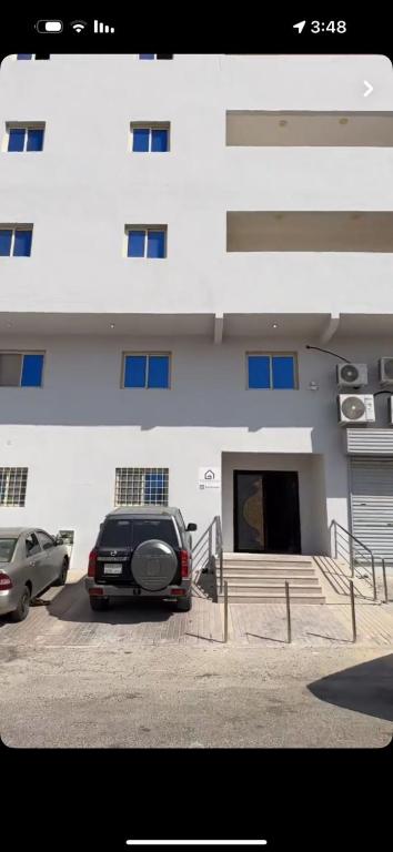 a car parked in front of a building at شقة مفروشة أنيقة وهادئه in Al Ahsa