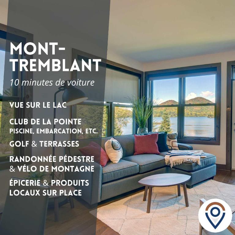 a living room with a couch and a table at Lake Resort Suite: Views & Amenities in Lac-Superieur