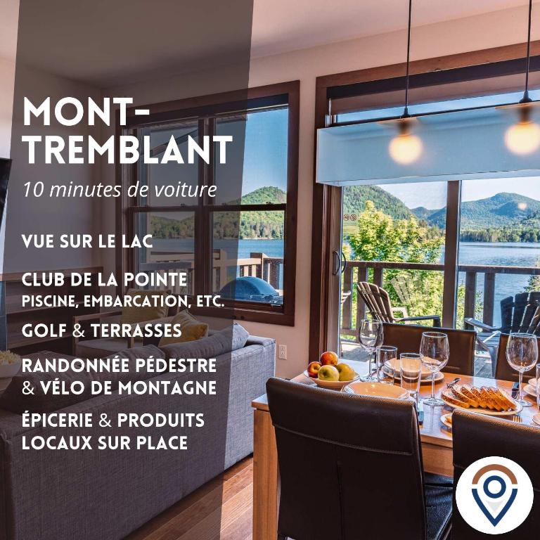 a dining room with a table with wine glasses at Lakefront Mountain View - Resort Loft in Lac-Superieur